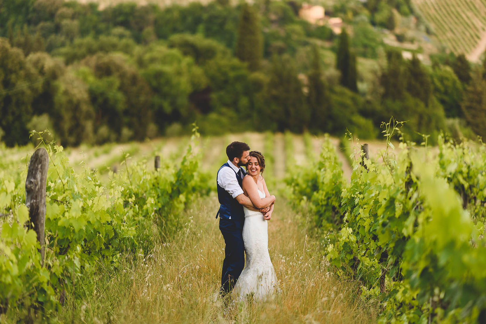 wedding photography in tuscany with bride and groom in a vineyard