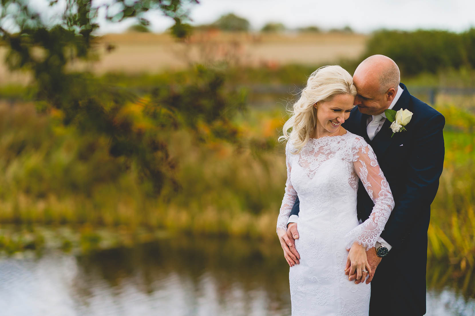 whit dove barns wedding photo by the front pond