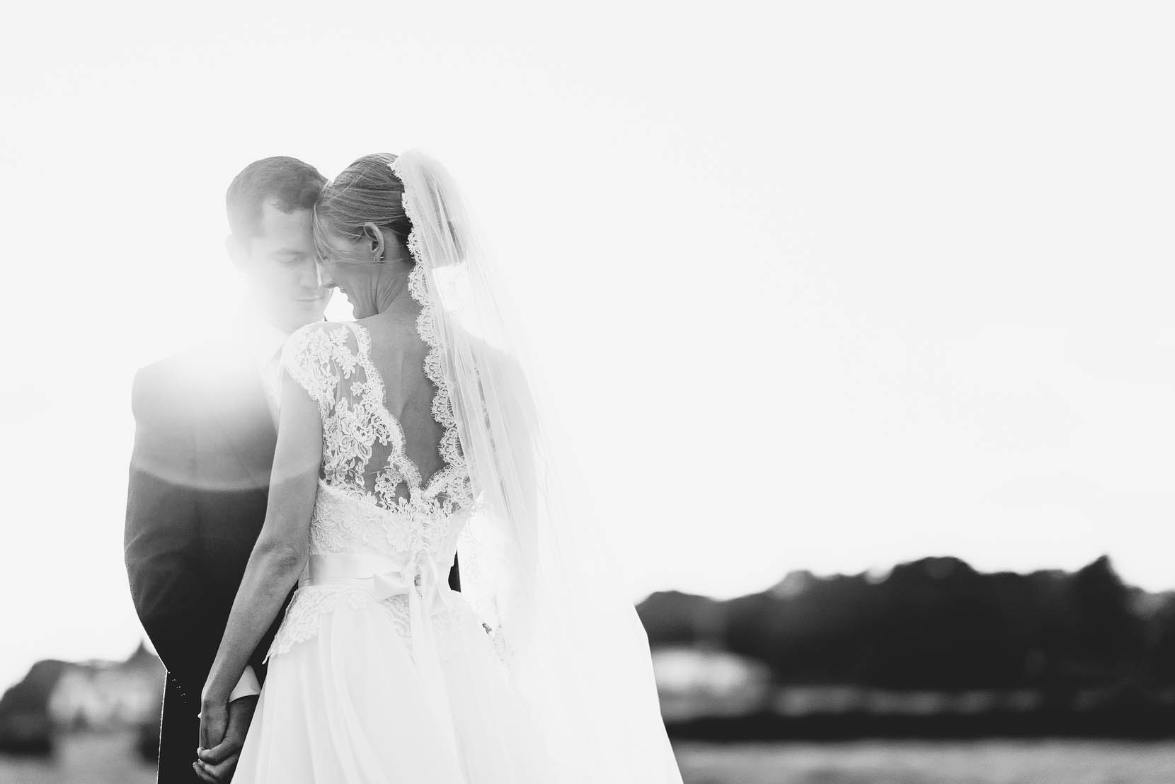 derbyshire wedding photography with tom and lucy cuddling in golden light