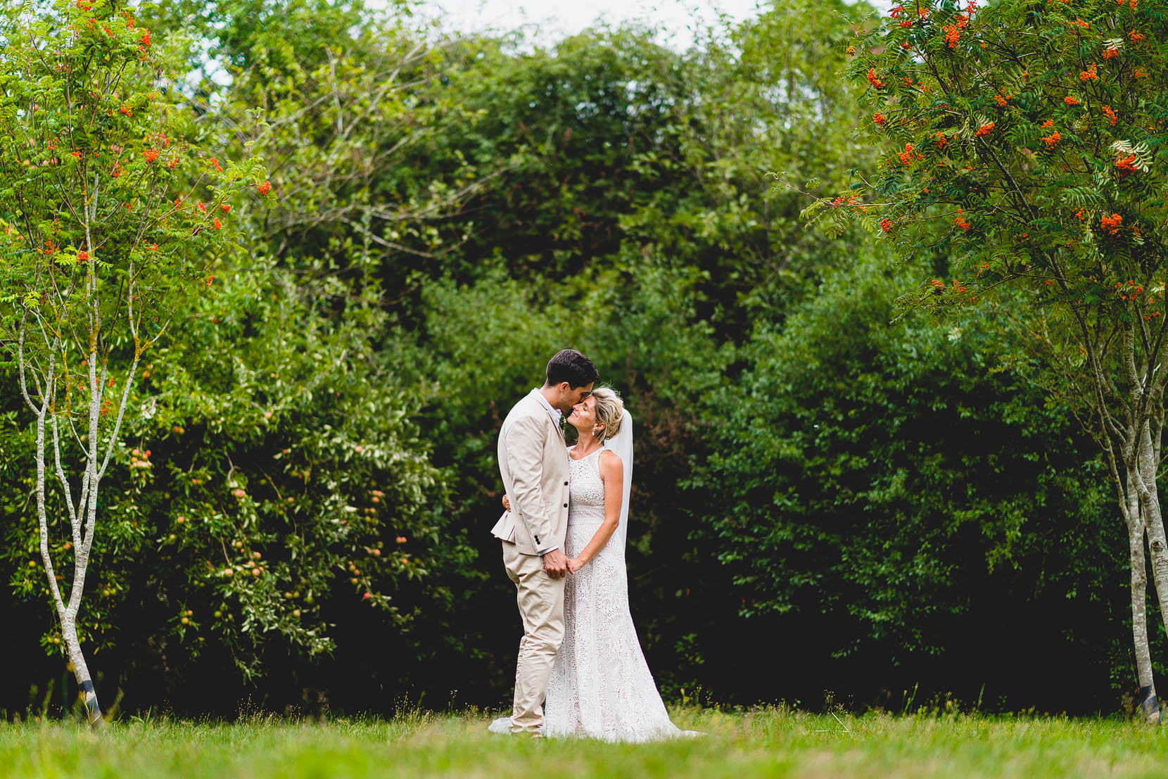 Tom and Jenny having a snuggle in mu and dads back garden in Swainsthorpe, Norfolk on their wedding day