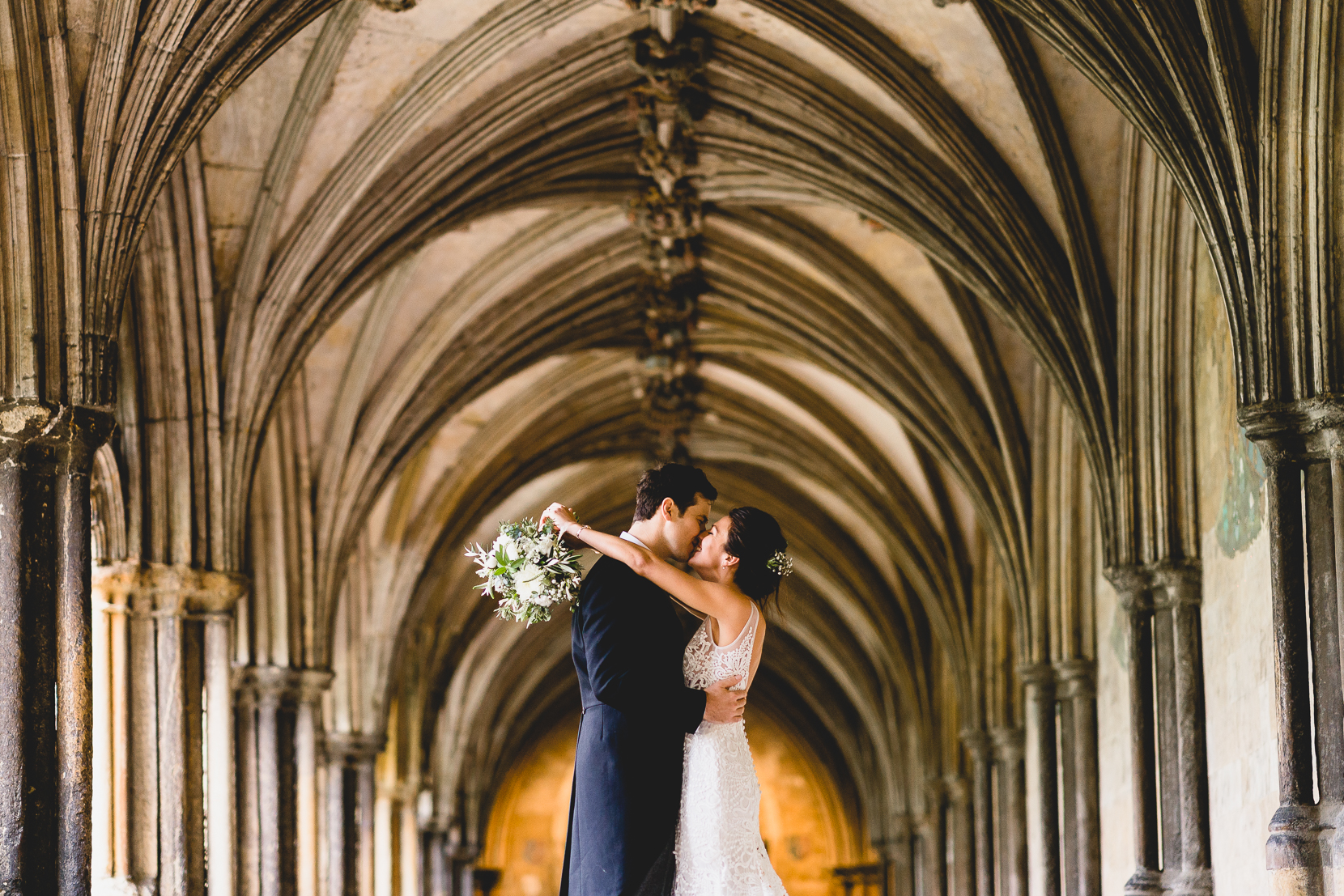 norwich cathedral wedding photography with harriet and tom have a post wedding kiss